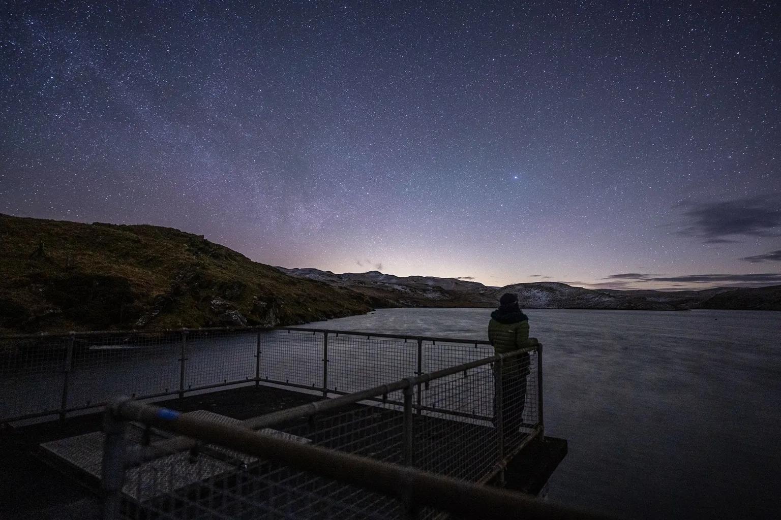 Serydda/Dafydd Wyn Morgan Rowenna surrounded by rocky outcropps and marshland beneath a starry sky