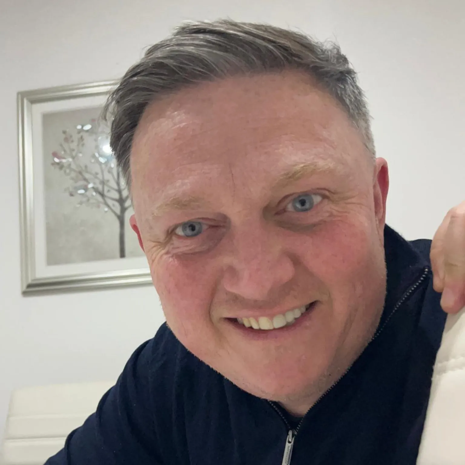 Paul Davies Paul Davies has short, greying hair swept to the side. He is looking into the camera from close up