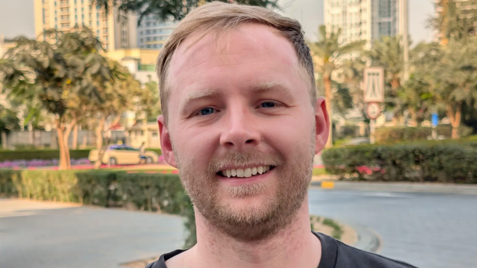 Zach Cairns A man with blonde hair looking at the camera smiling