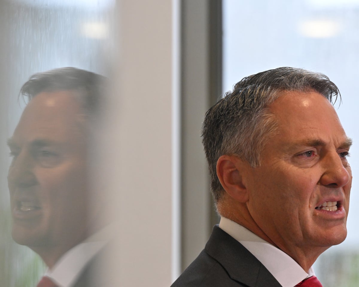 Deputy prime minister, Richard Marles, answers questions in the press gallery corridor between media interviews.