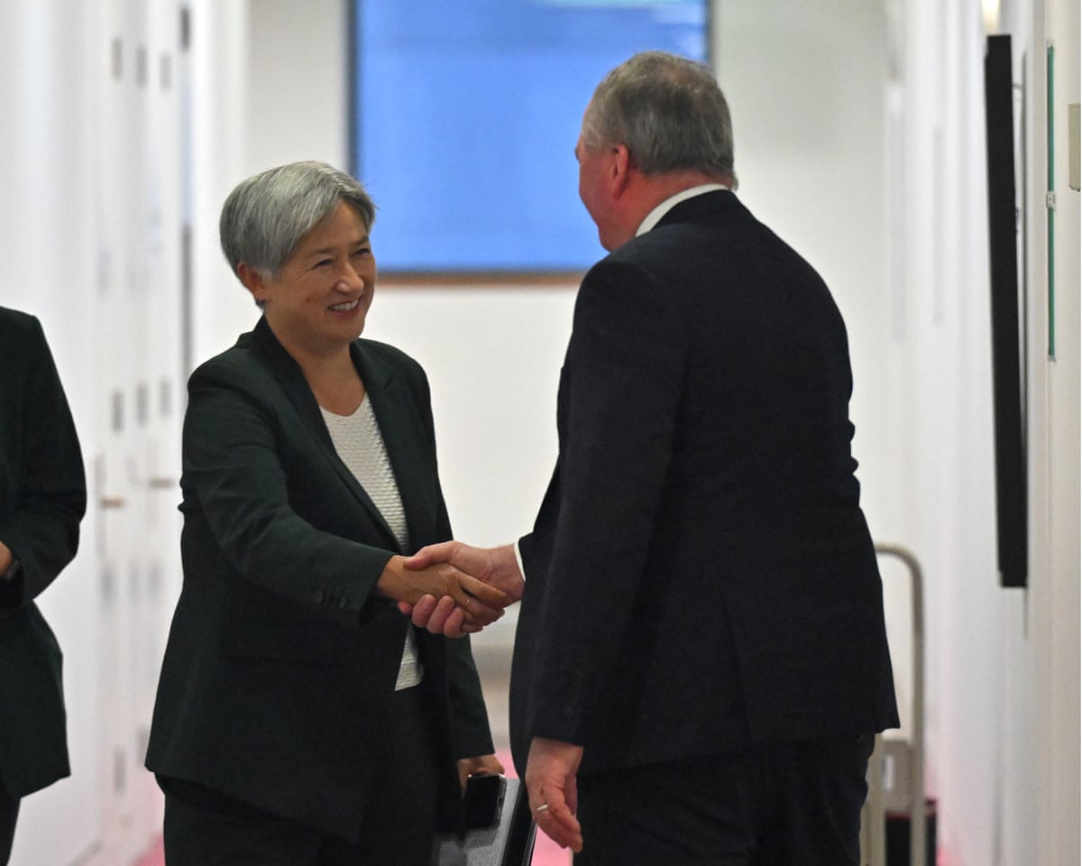 One Nation member for New England, Barnaby Joyce, greets Penny Wong.