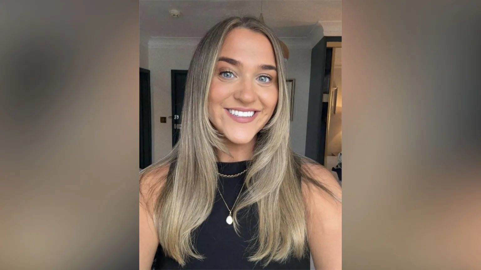 Ami Clarke Ami Clarke in a selfie-style image. She is smiling at the camera and has long blonde hair. She is wearing a black tank top with a necklace.