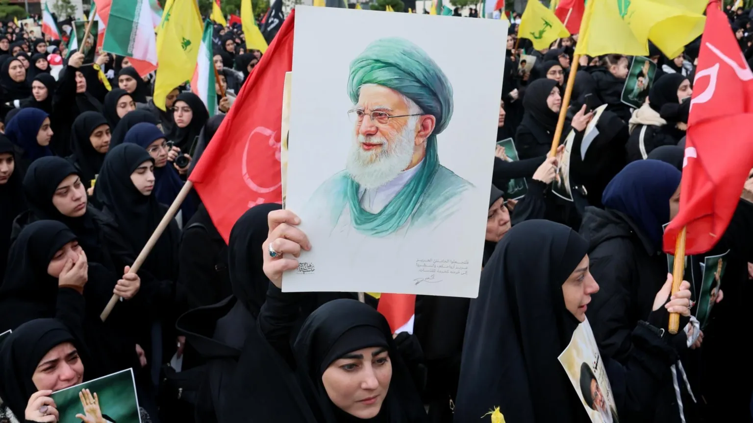 EPA Hezbollah supporters carry pictures of the late Iranian Supreme Leader Ayatollah Ali Khamenei during a gathering in solidarity with Iran, in Beirut's southern suburbs, Lebanon (1 March 2026)
