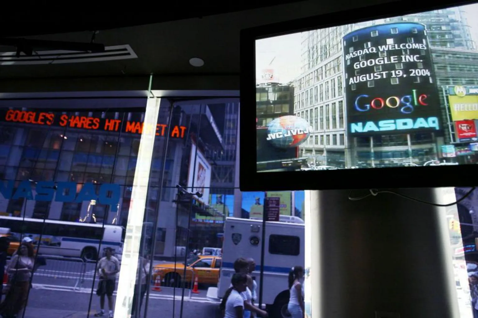 The Google logo appears on a screen and ticker inside the NASDAQ Marketsite just before the markets close August 19, 2004 in New York City.