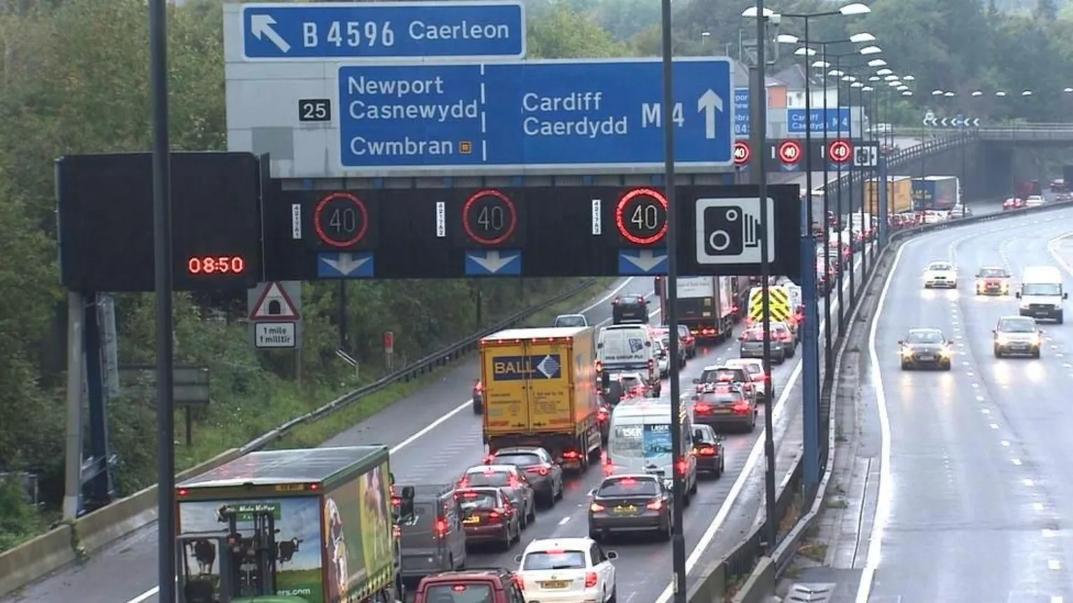 A busy road with a queue of traffic.