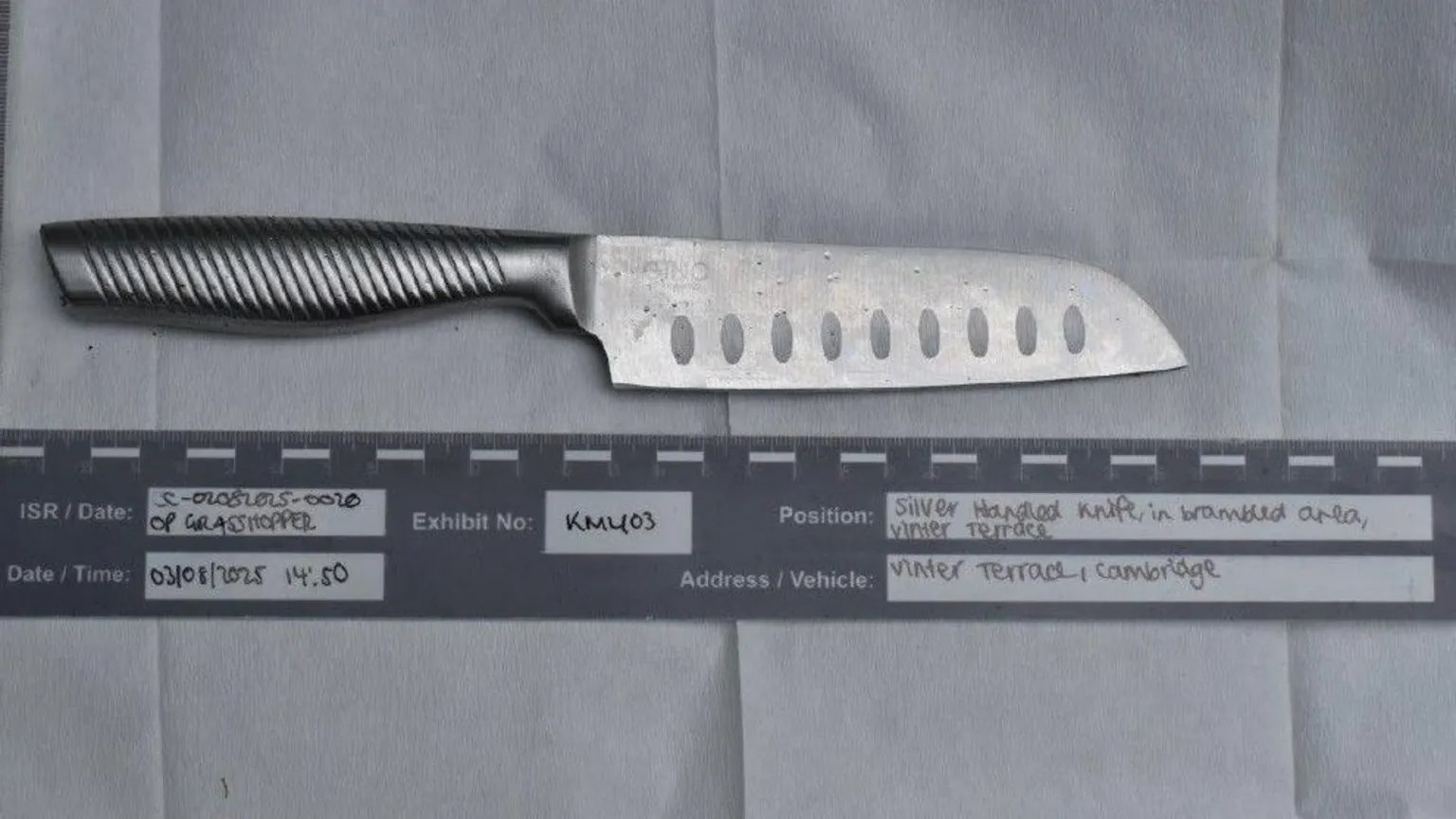 Cambridgeshire Police A police image of a large-bladed chopping knife placed on paper, with labels under it the read the Date/time it was found, the exhibit number and where it was found.