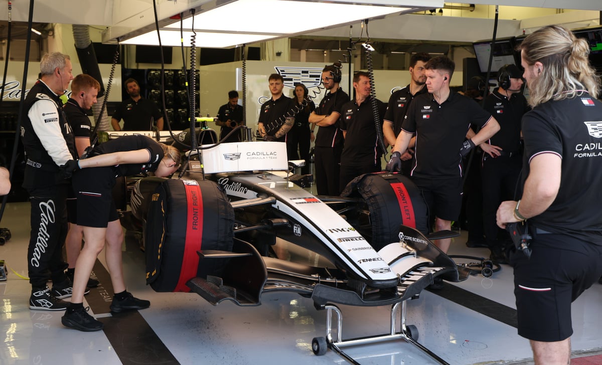 Mechanics work in the garage of the Cadillac driver Valtteri Bottas during F1 pre-season testing