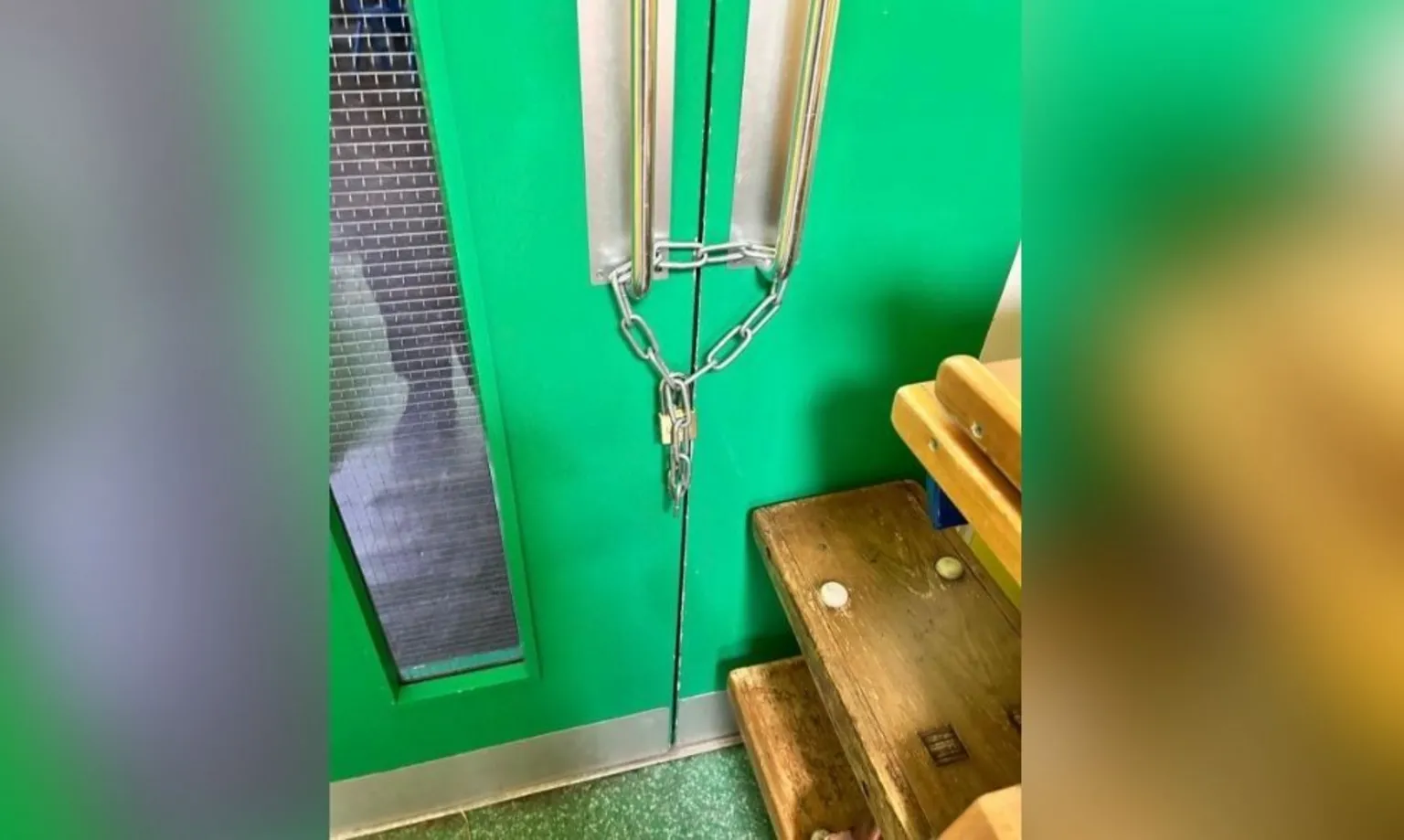 Rosetta Primary School A green door with a padlock and chain on it