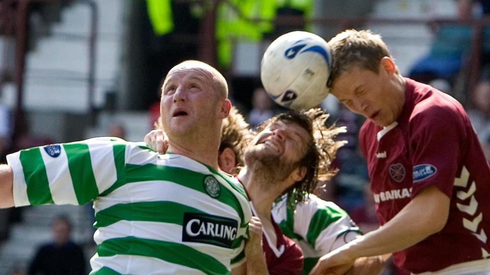 Christophe Berra (right) heading the ball while playing for Hearts