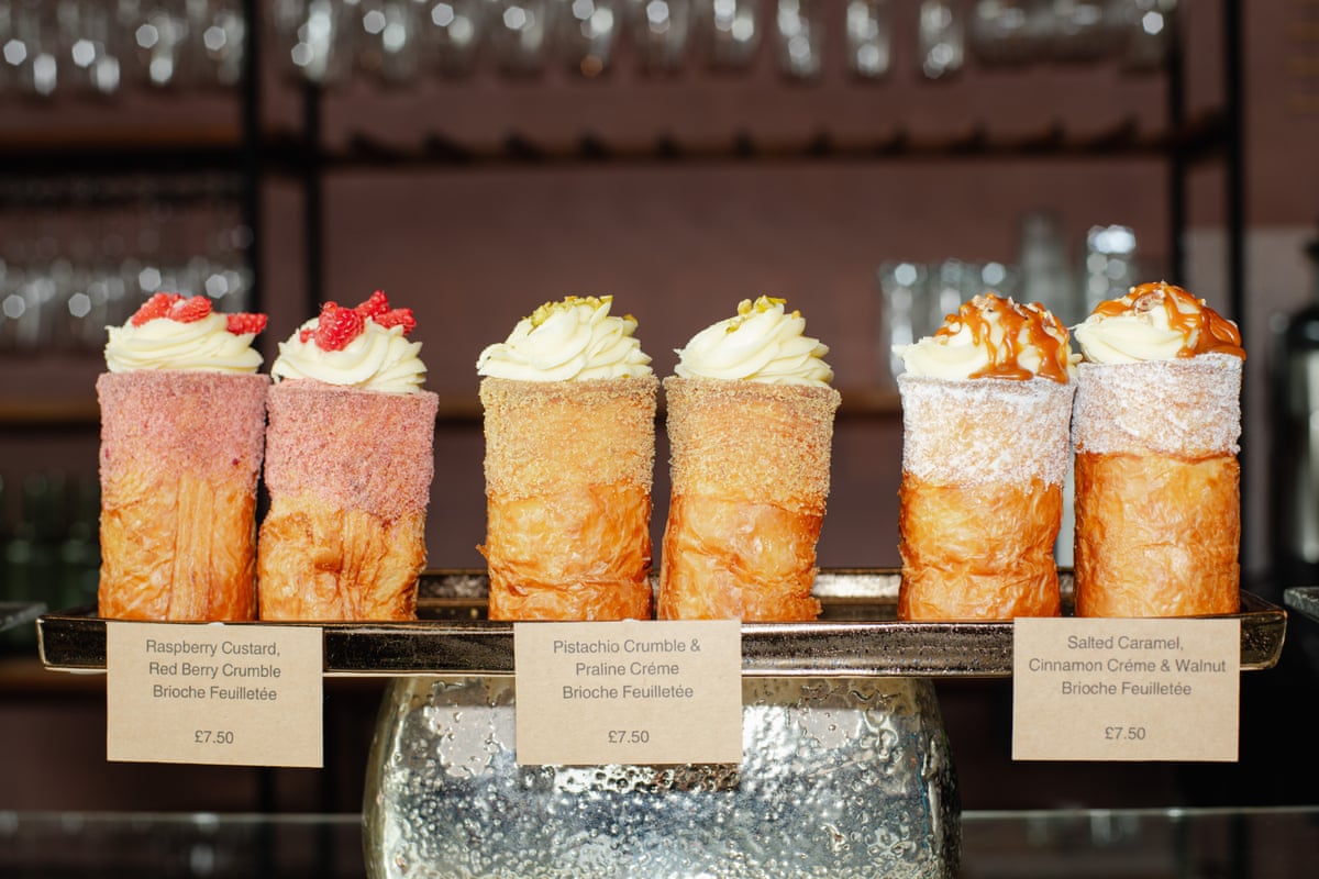 Three varieties of the bake sit on a counter side by side, with price tags below