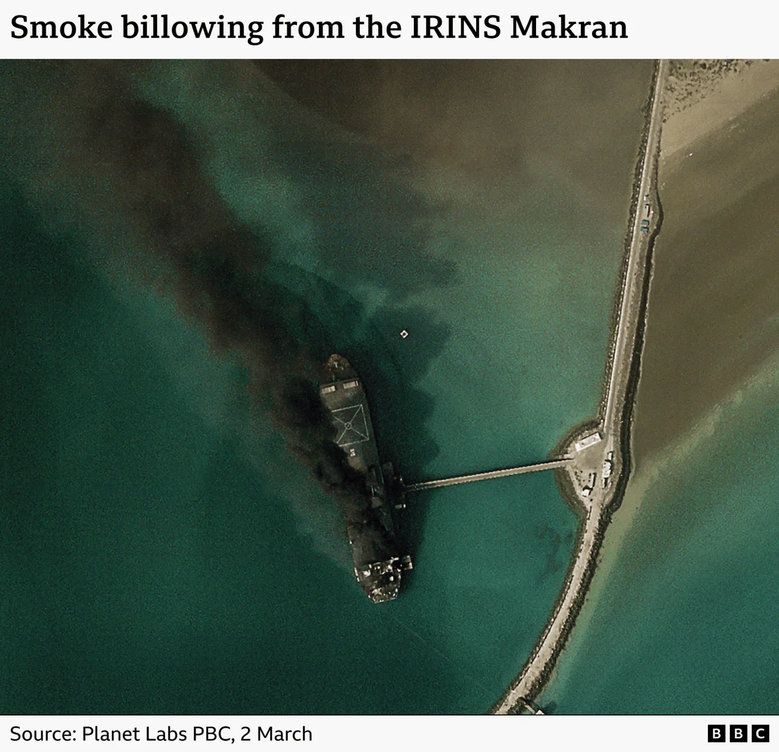 A satellite image showing an Iranian ship ablaze in a port. The caption reads 