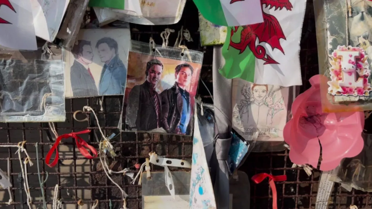 close up of shrine. Shows pictures of John Barrowman and Gareth David Lloyd