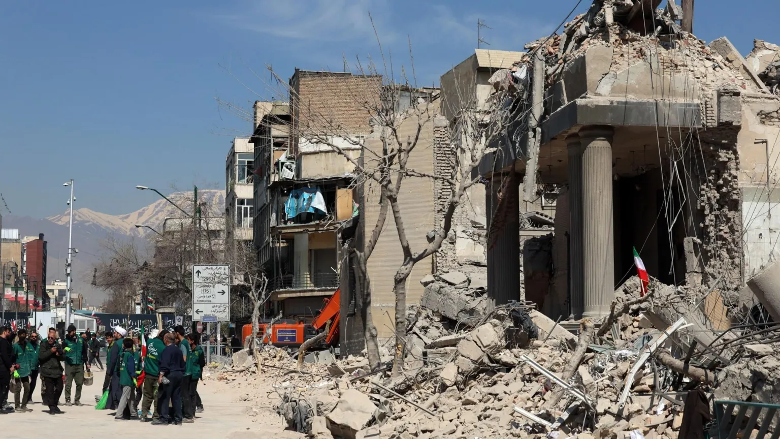 EPA Iranians gather around a damage police station in central Tehran, Iran (4 March 2026)