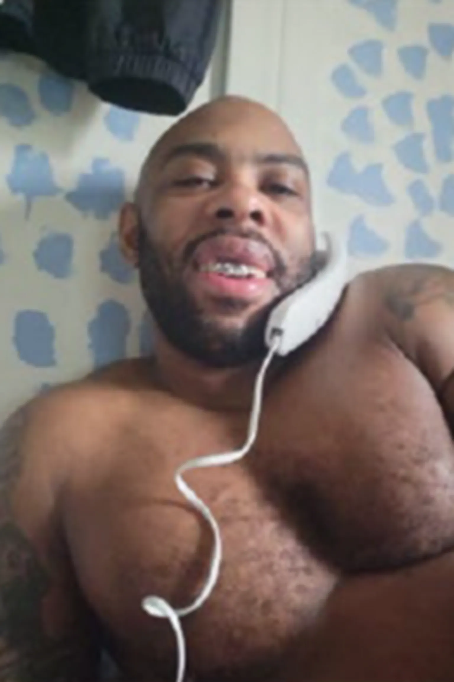 Nottinghamshire Police Yeboah is topless and on a traditional phone with a cord