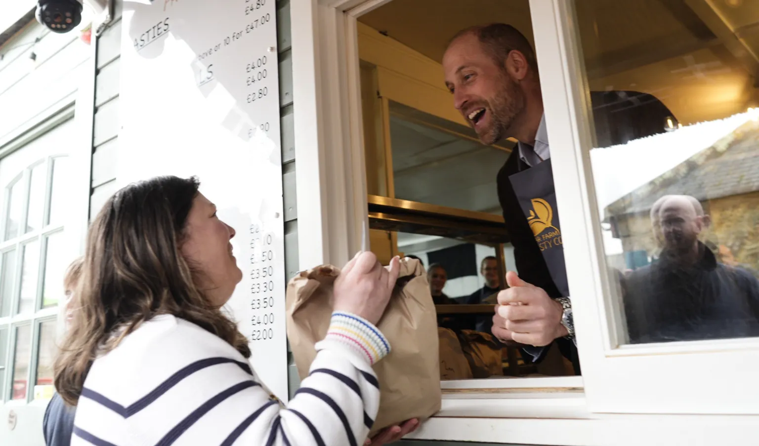  The Prince of Wales, known as the Duke of Cornwall while in Cornwall, serving customers during his visit to the Gear Farm Pasty Company.