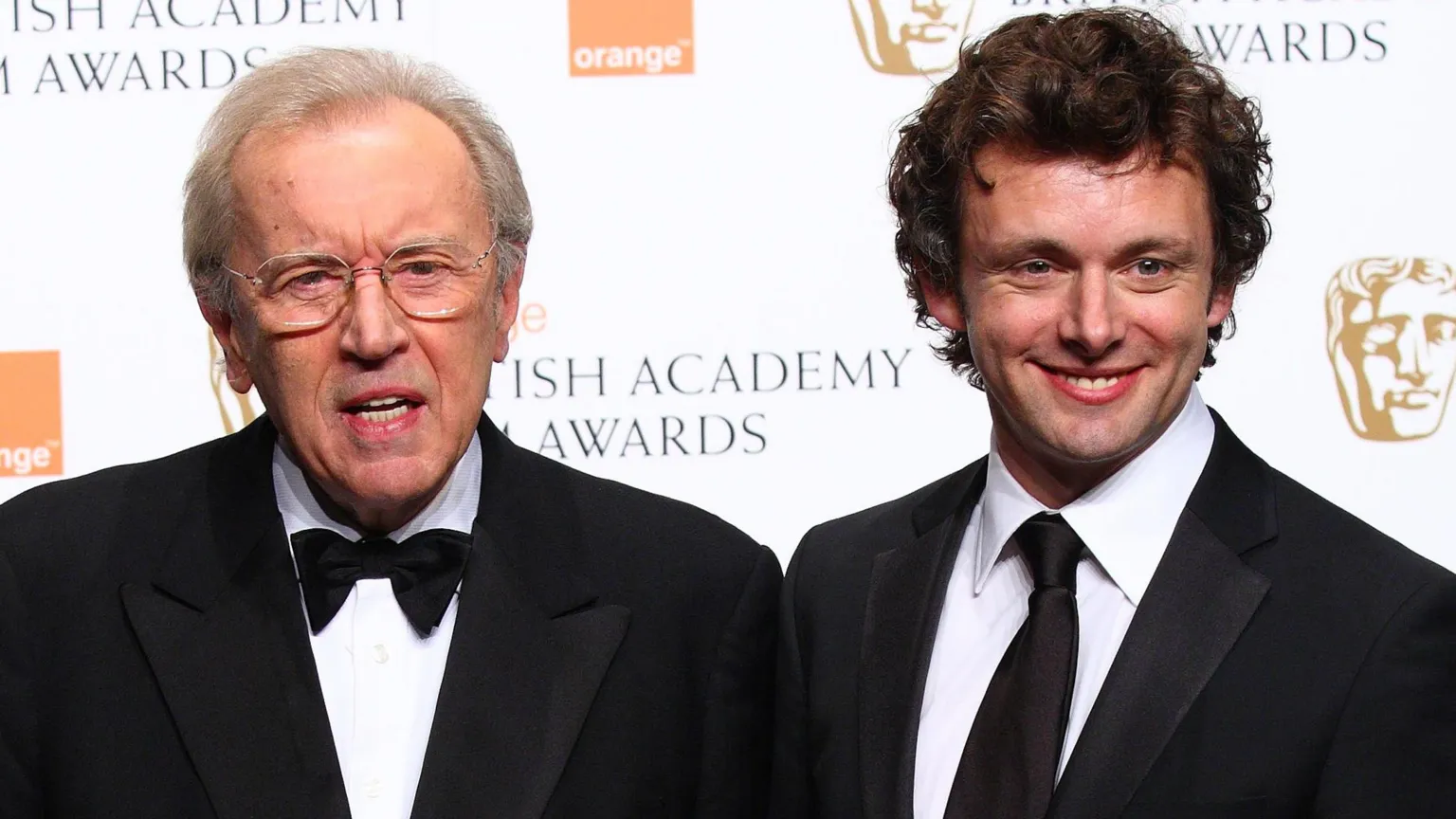  Frost and Sheen both wears black suit jackets on the BAFTA red carpet. Frost with a bow tie, Sheen with a tie