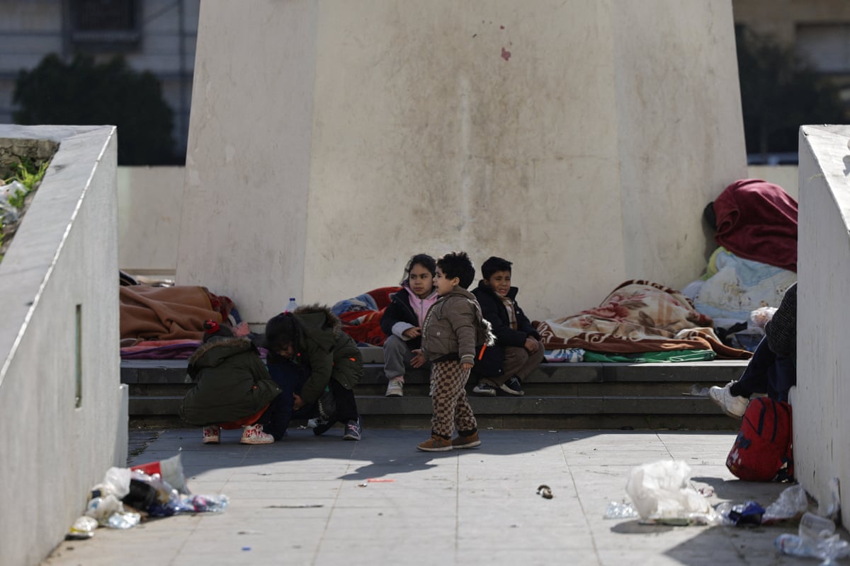 Five children sat on blankets placed on ground in Martyrs' Square in Beirut.
