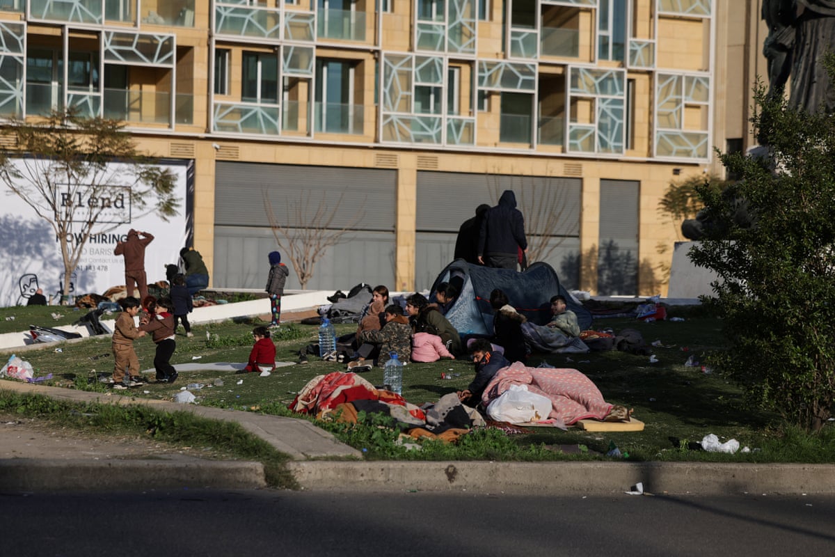 Displaced families seeking safety set up tents in the central square of Beirut.