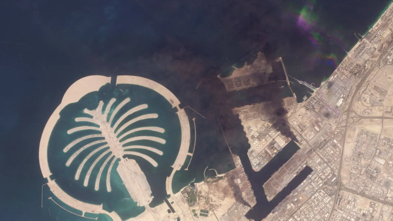 /Planet Labs PBC A satellite image of Jebel Ali Port, after one of the berths caught fire because of debris from an intercepted missile, in Dubai, United Arab Emirates