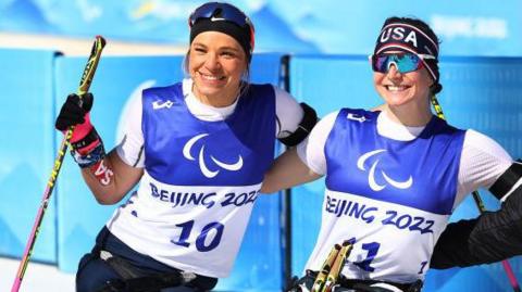 Oxsana Masters and Kendall Gretsch pose after one of their races in Beijing