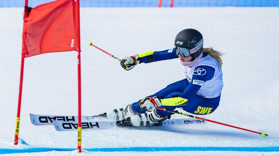 Swedish skier Ebba Aarsjoe negotiates a gate during a run at St Moritz