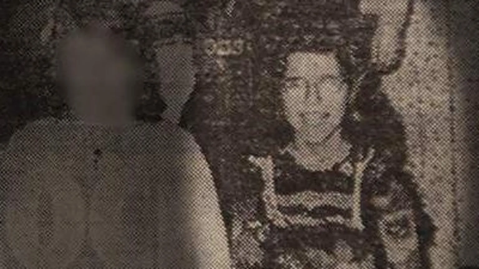 Black and white photograph of Angela as a child. 