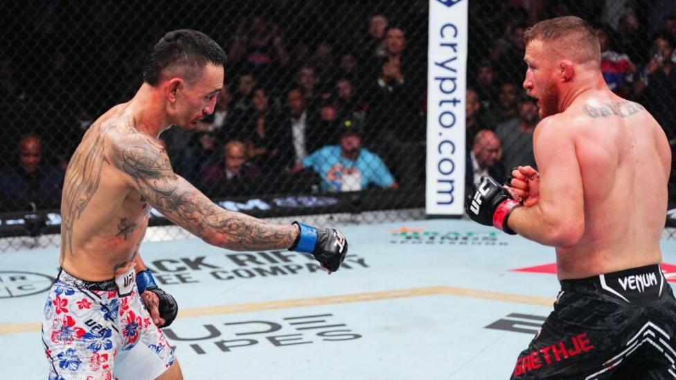 Max Holloway in action against Justin Gaethje at UFC 300