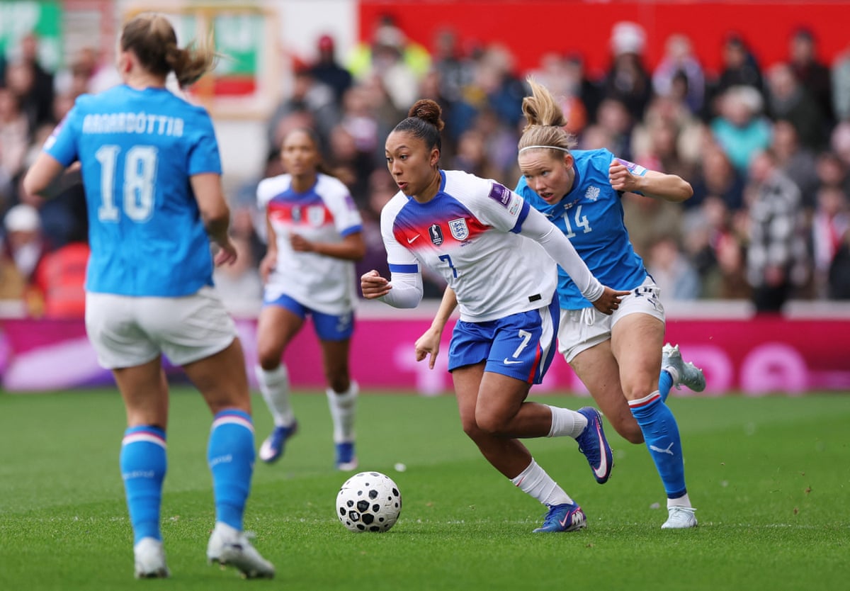 England's Lauren James surges forward chased by Iceland's Hlin Eiriksdottir.