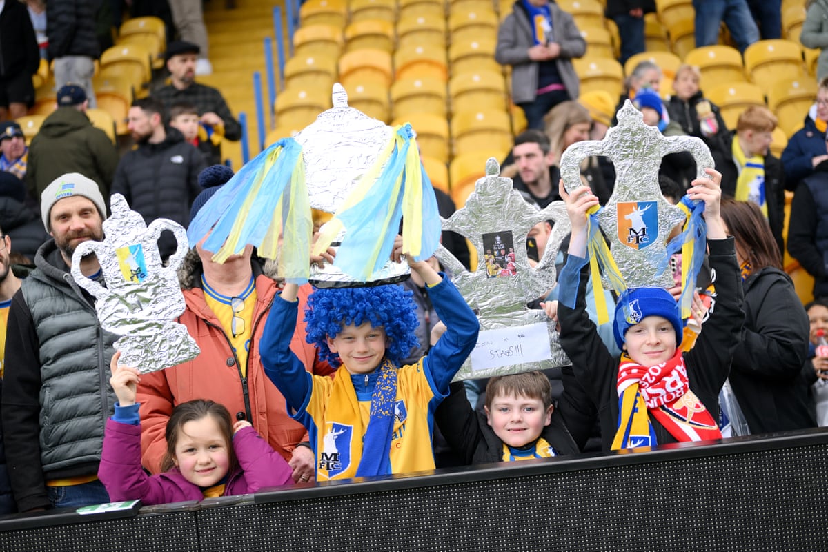 A few young Mansfield fans hold up tinfoil Cups.