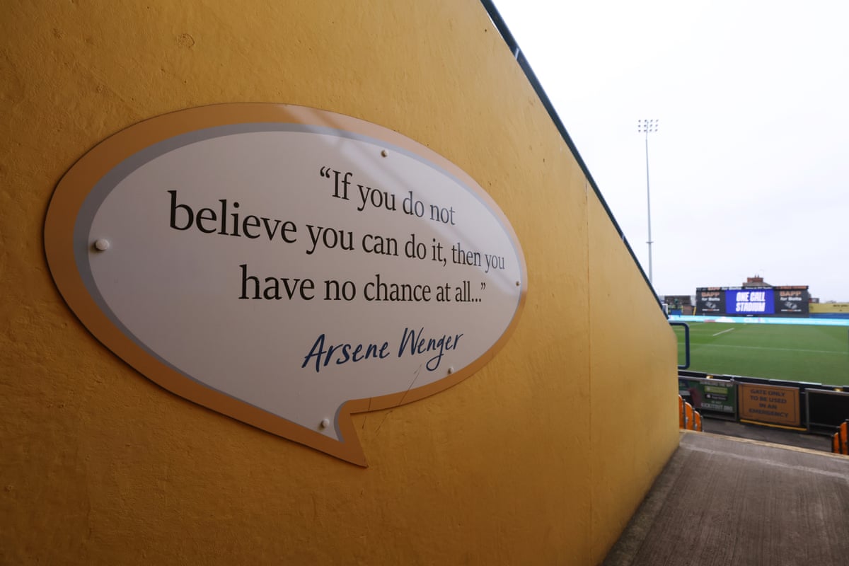 An Arsène Wenger quote on the stadium walls.