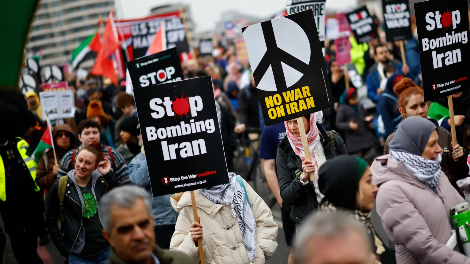 EPA Protesters carrying signs that read 'Stop bombing Iran' and 'No war on Iran'.