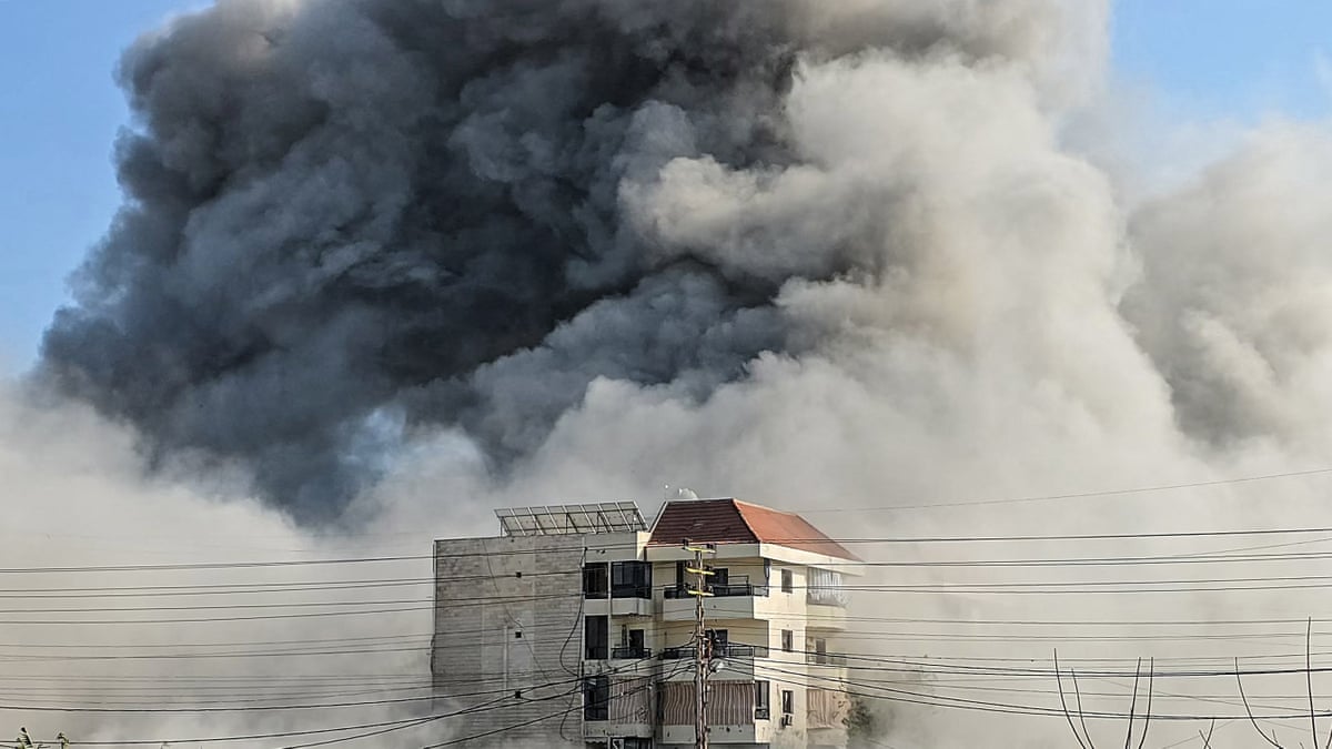 A plume of smoke over a building