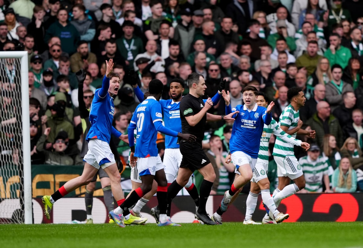 The Rangers players appeal for a handball but VAR says no.