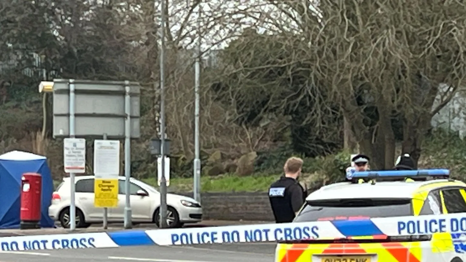 A close-up picture of a blue and white police cordon which says 