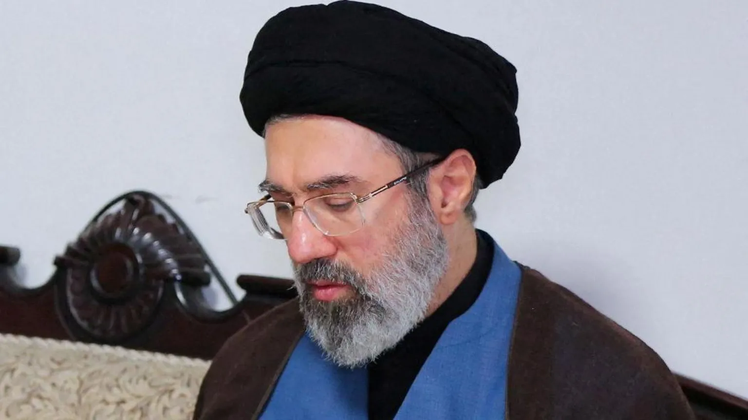 West Asia News Agency Via Wearing a black turban and spectacles, Mojtaba Khamenei is pictured during a visit to Hezbollah's office in Tehran in 2024. 