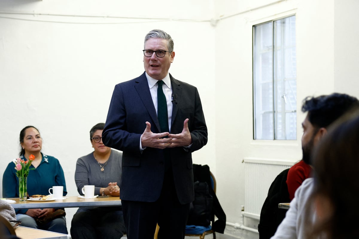 Keir Starmer talks during a visit to a community centre in London.