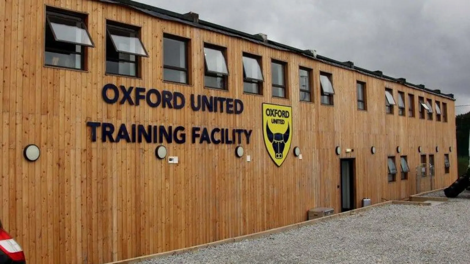 Steve Daniels A wooden building with the Oxford United badge and the words 
