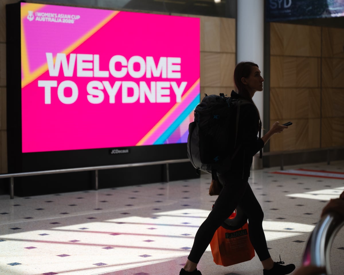 Passengers on a flight from Dubai arrive at Sydney international airport in Sydney on6 March.
