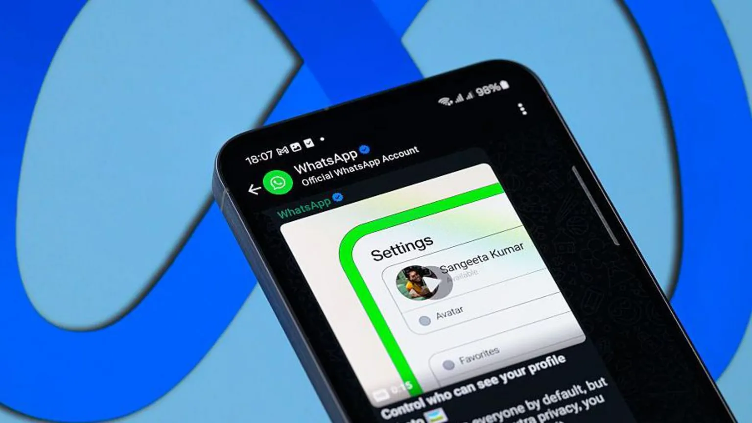  WhatsApp displayed on a smartphone. A message from the Official WhatsApp Account on the app is displayed on the screen, with a video captioned 