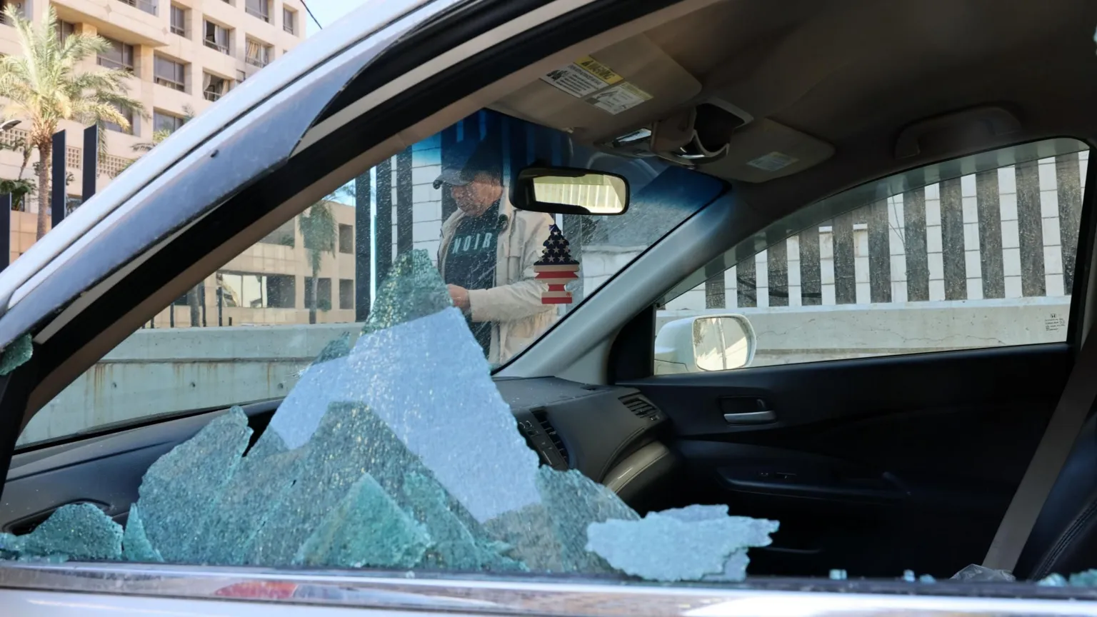 EPA A car with a broken window near the Ramada Plaza hotel, following an Israeli strike that the Israeli military says killed four Iranian Revolutionary Guards, in Raouche, Beirut, Lebanon (8 March 2026)