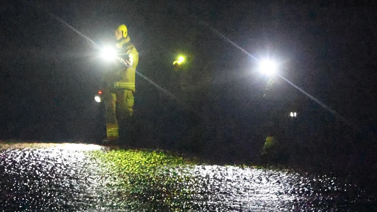 Callan Media A very dark picture of some searchers with torches on the Solway Coast