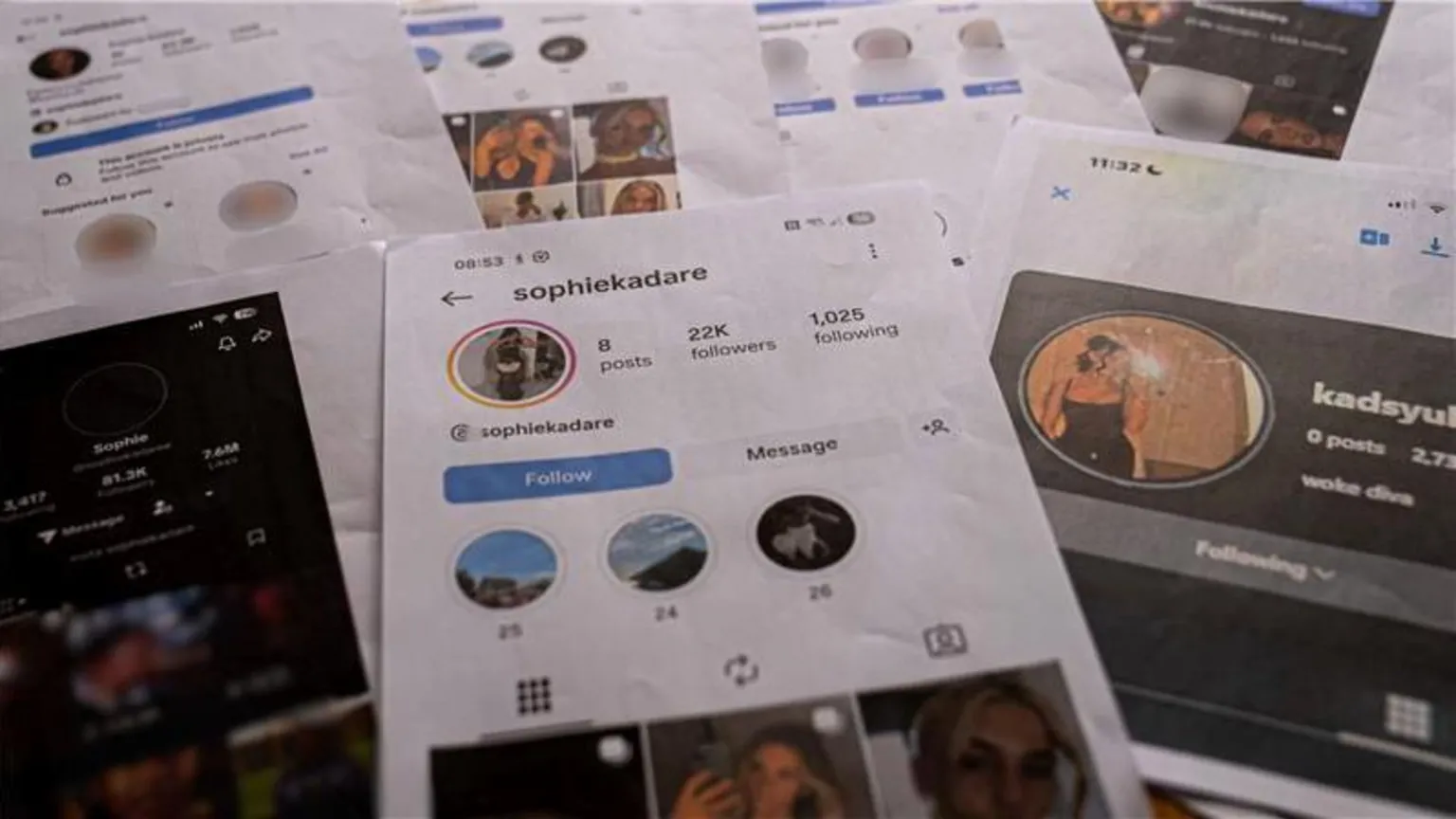 Seven A4 print outs of screenshots of the Sophie Kadare fake accouts laid out on a table. The main image in the middle shows the instagram account, which has 22k followers and eight posts, filled with Sasha's images. 