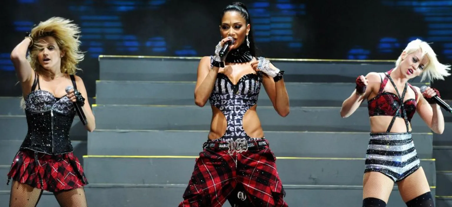  Pussycat Dolls Ashley Roberts, Nicole Scherzinger on and Kimberly Wyatt perform in Manila on June 11, 2009. 