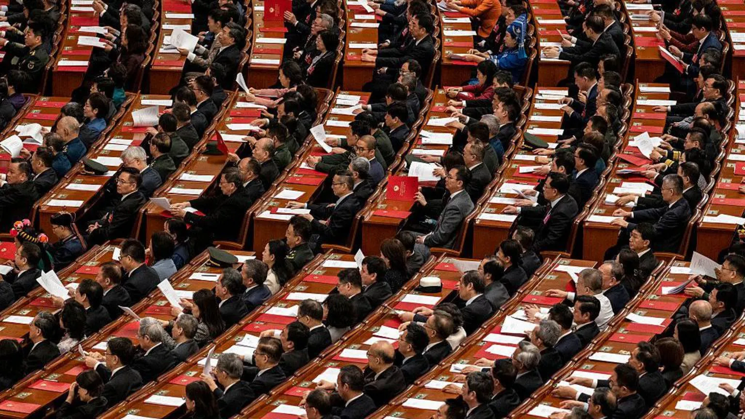 Delegates listen to speeches at the closing session of the Chinese People's Political Consultative Conference (CPPCC) at the Great Hall of the People on March 11, 2026 in Beijing, China