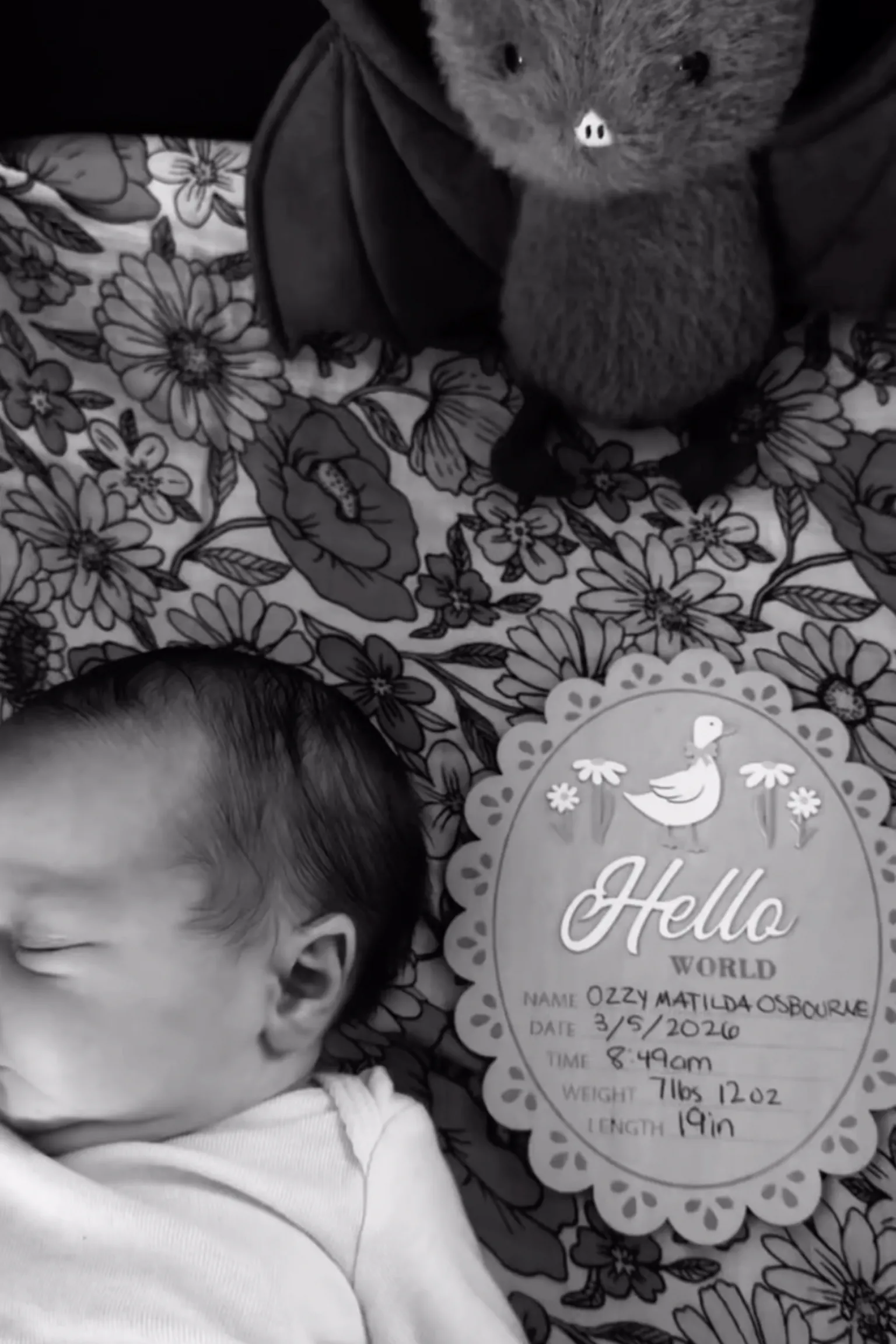 Jack Osbourne/ Instagram A picture of a baby in black and white, with a birth detail card and a small bat toy pictured.