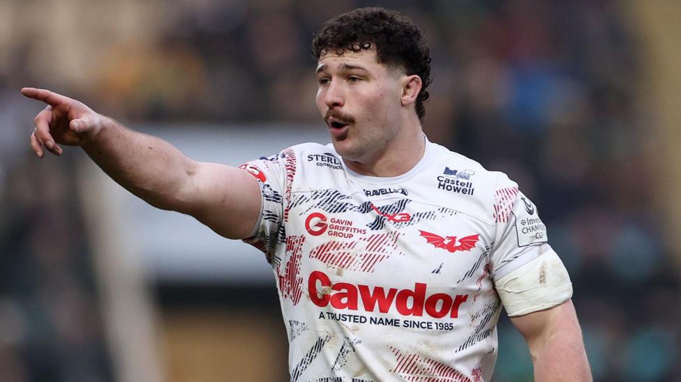 Fletcher Anderson points while in action for Scarlets at Northampton
