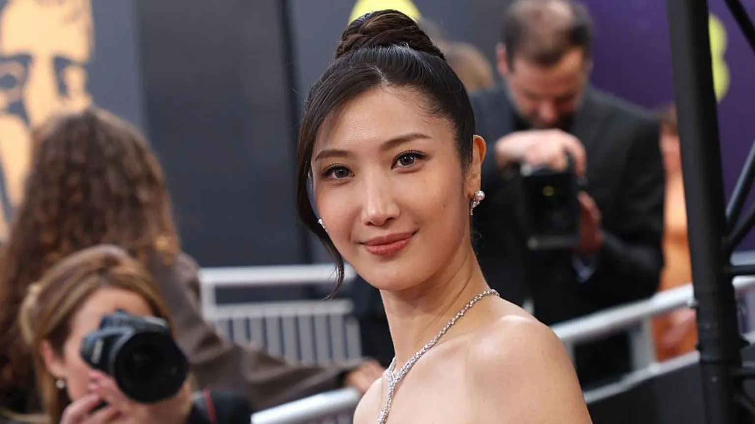 Singer Ejae poses for pictures on a red carpet event