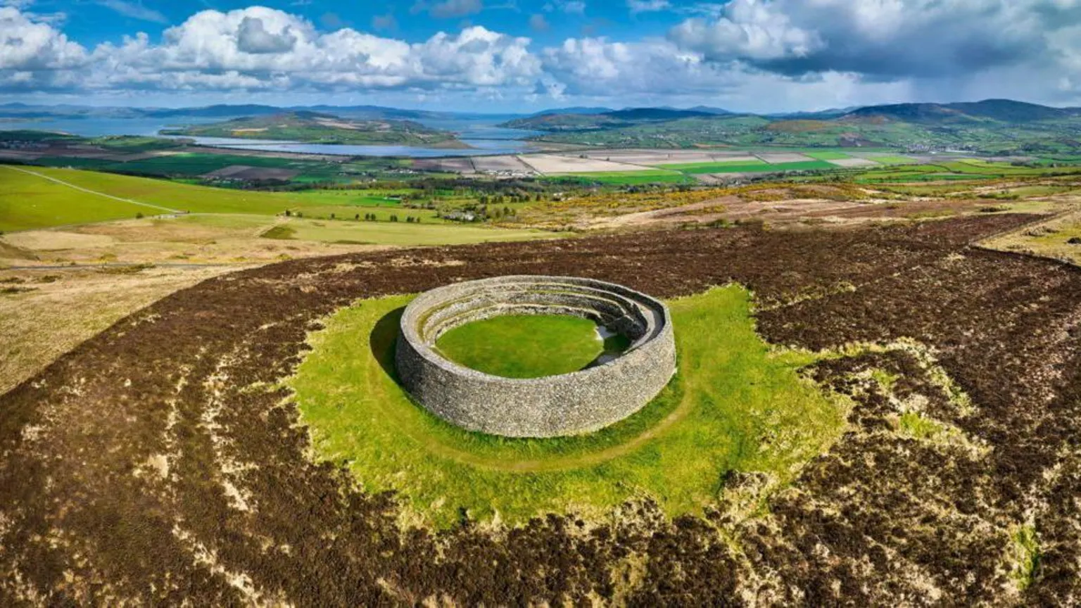 Grianán of Aileach, a circualr stone fort on top of a hill.