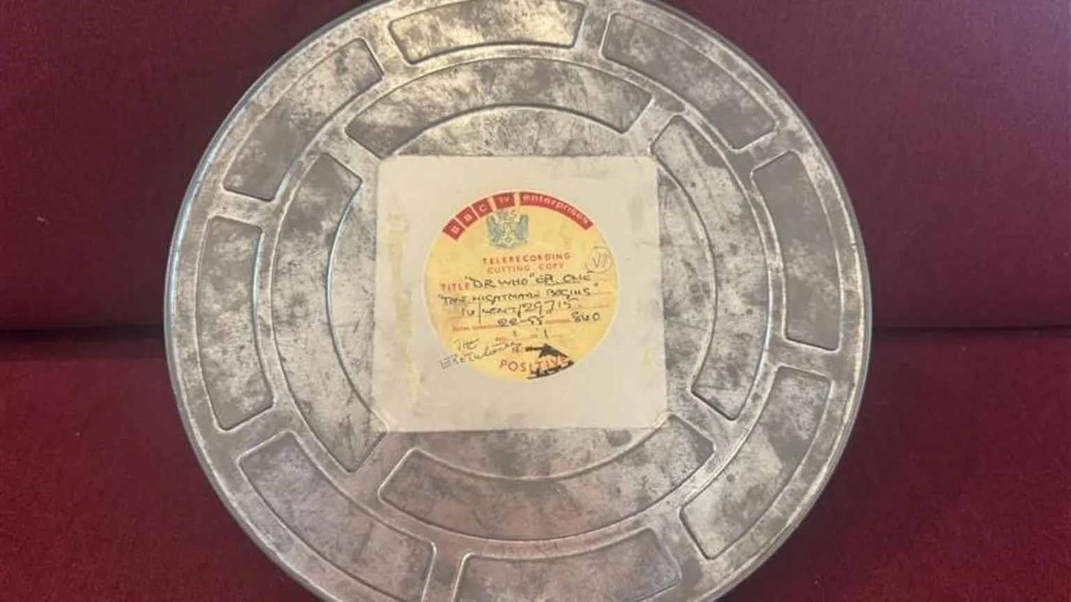 A circular film reel tin with a vintage BBC TV Enterprises label. It says 'Telerecording cutting copy' and has handwritten details on the label.