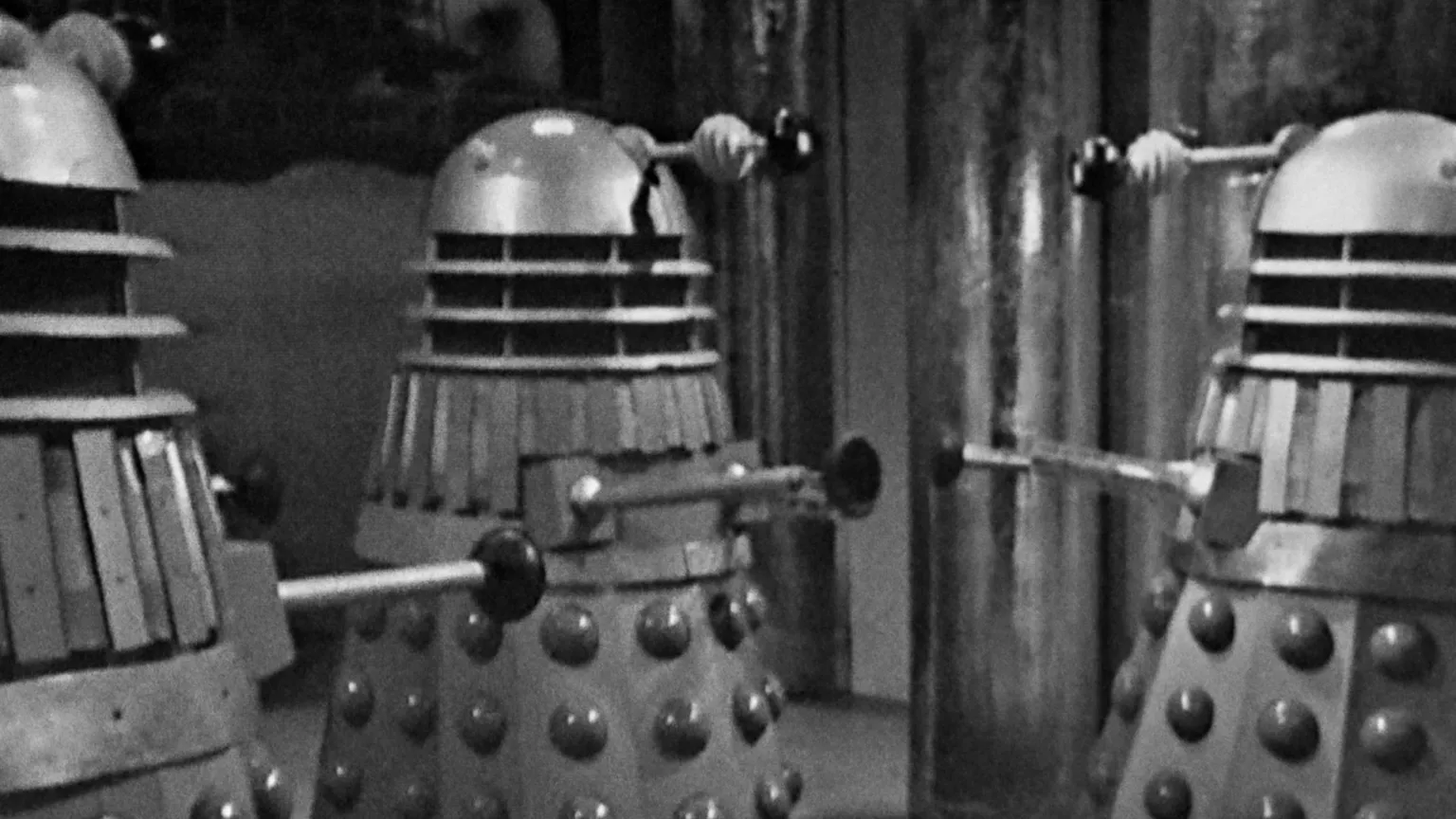 Doctor Who/BBC A black and white still of three daleks from a Doctor Who episode